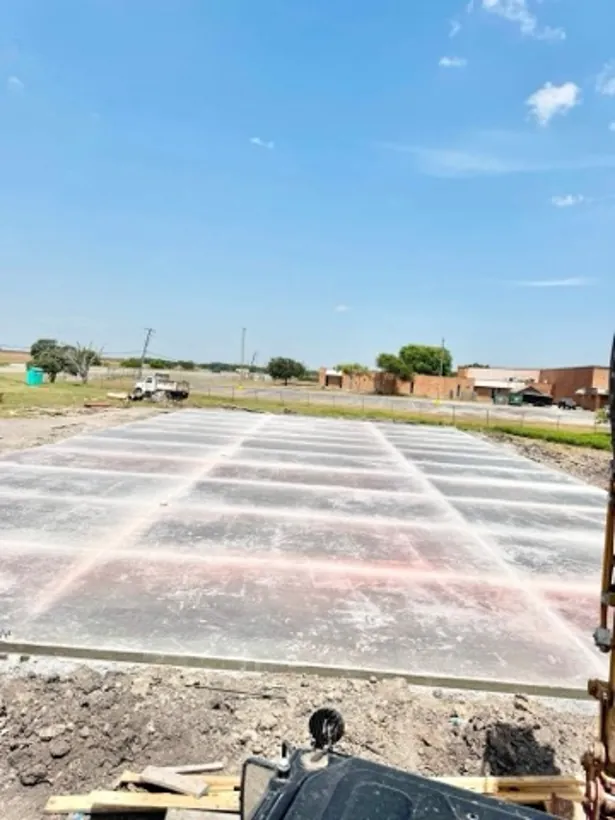 Large school pad sheeted and marked out before the pour