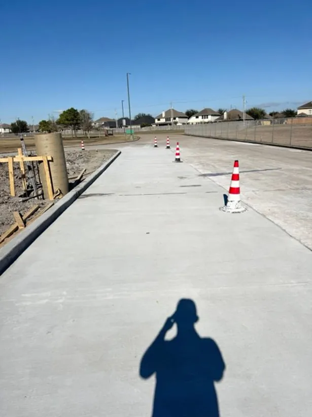 Wide finished commercial slab coned off after the pour