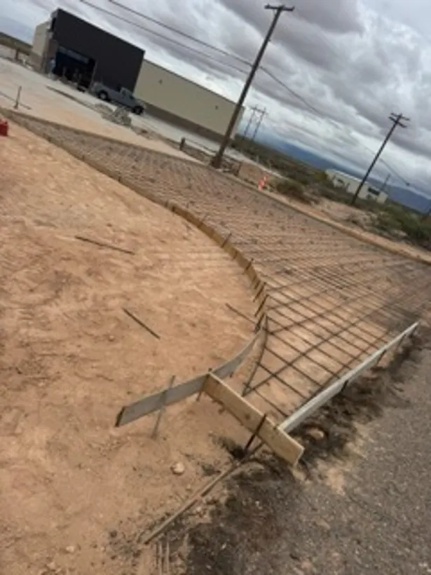 Curved subgrade formed and tied out on a commercial site