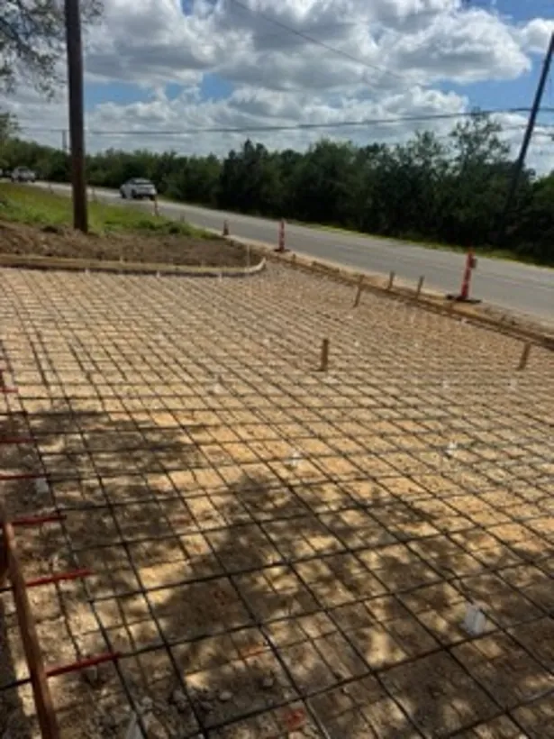 Rebar grid tied out across a large commercial pad
