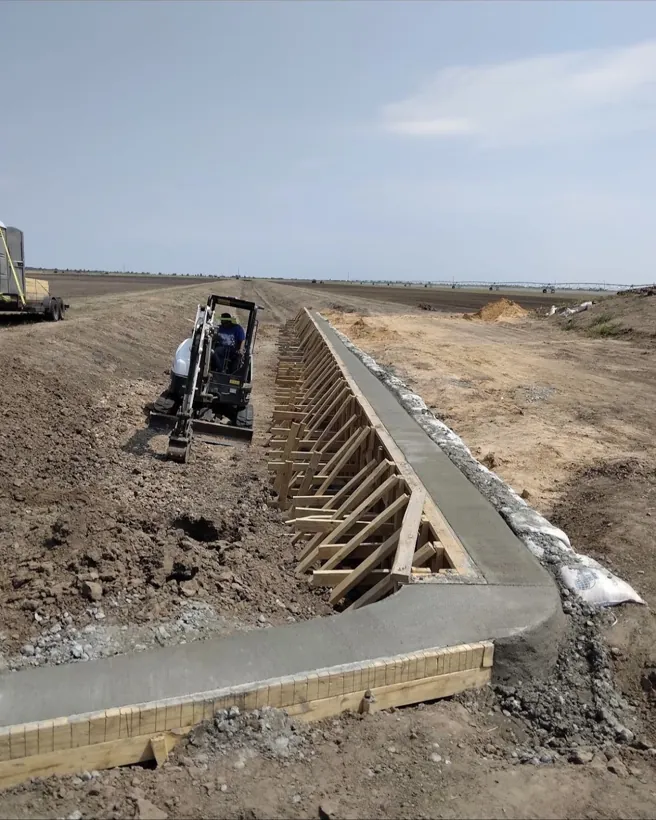 Poured in place concrete headwall and wingwalls for site drainage