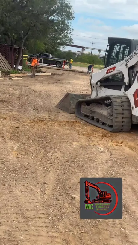 Skid steer grading and shaping subgrade before forms go down