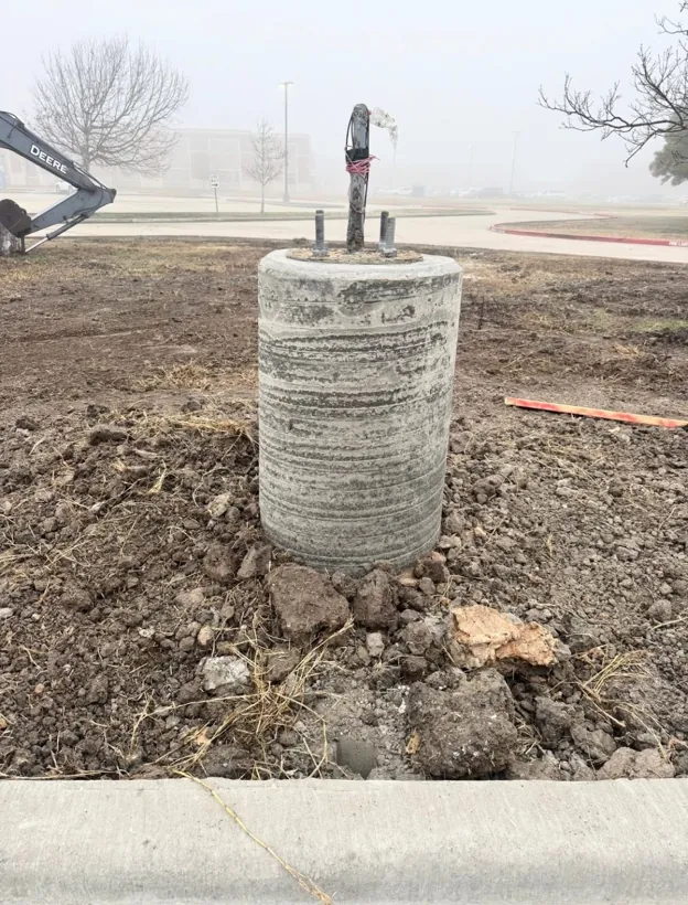 Poured in place concrete pier set to grade on a foggy morning