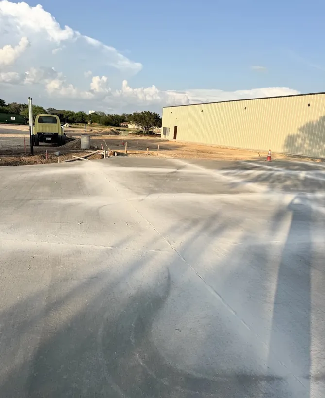 Wide finished commercial lot poured and swept clean
