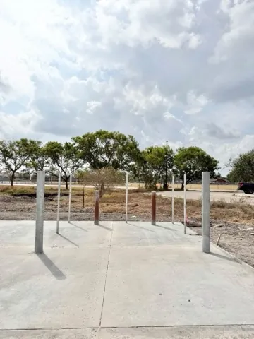Finished slab with steel posts set for a shade structure