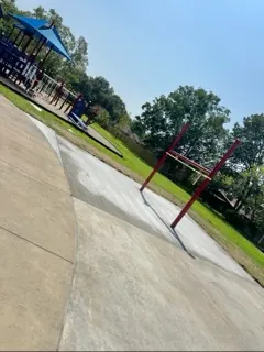 Finished walkway poured beside a park playground