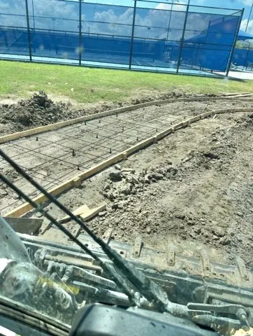 Curved walkway formed and tied out by the tennis courts