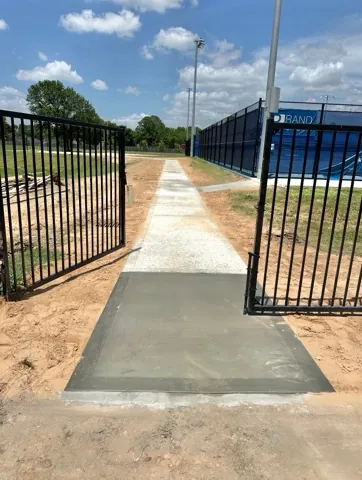 Finished walkway and gate apron at the tennis courts